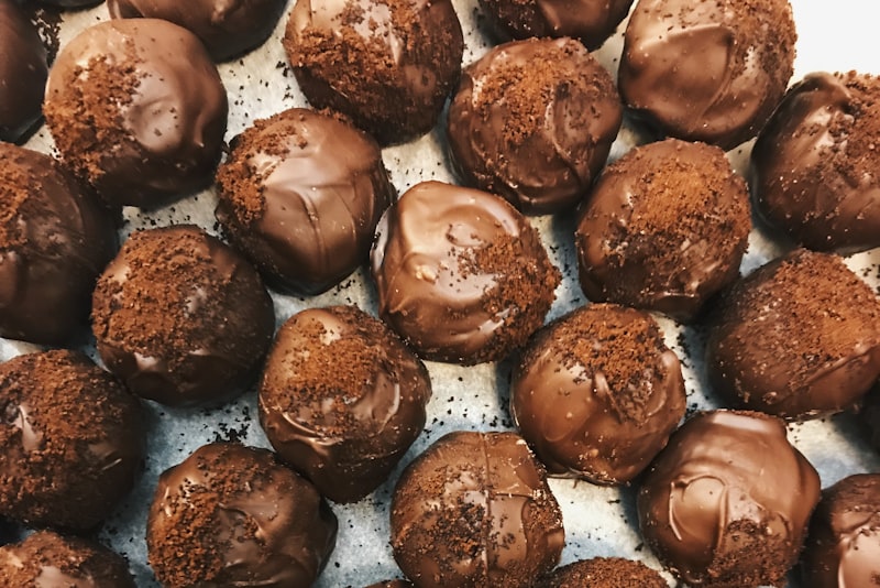 Fudgy brownies stacked on parchment